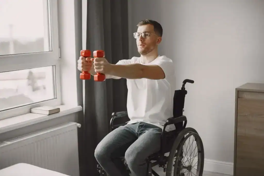 Image of man doing exercise in his wheelchair to aid weight loss Bicester