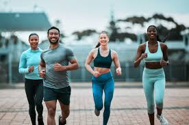 Sculpting Sleek Arms: The Essential Role of Cardio in Toning Without Bulking Up 3 image of people running to incorporate cardio Bicester exercise into their life to help tone arms and body.